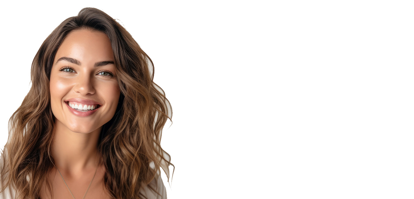The image is a photograph of a woman with long hair, smiling at the camera. She has a fair complexion and appears to be in her mid-20s to early 30s. The background is plain white, emphasizing the subject.